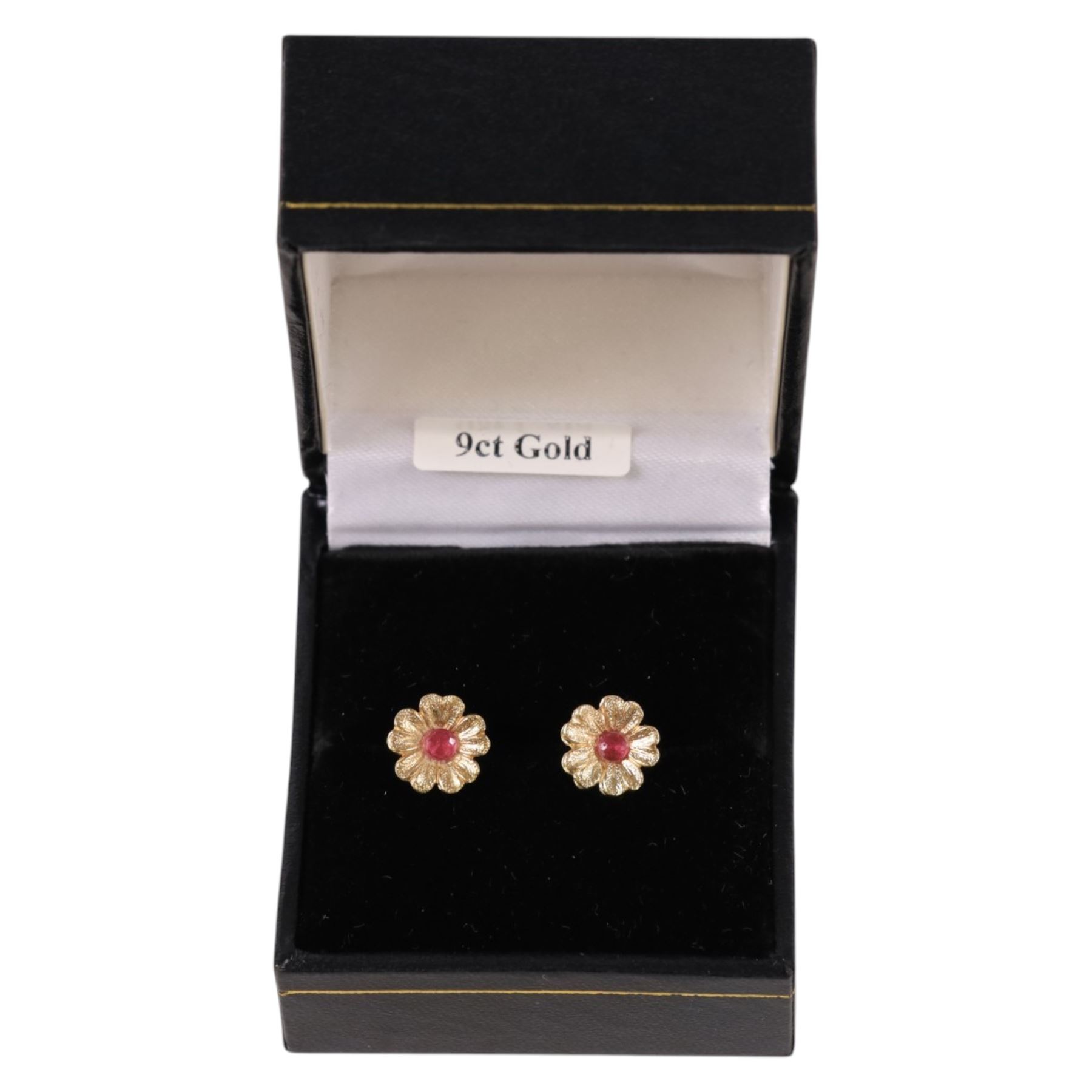 Pair of 9ct gold and ruby flower stud earrings, boxed