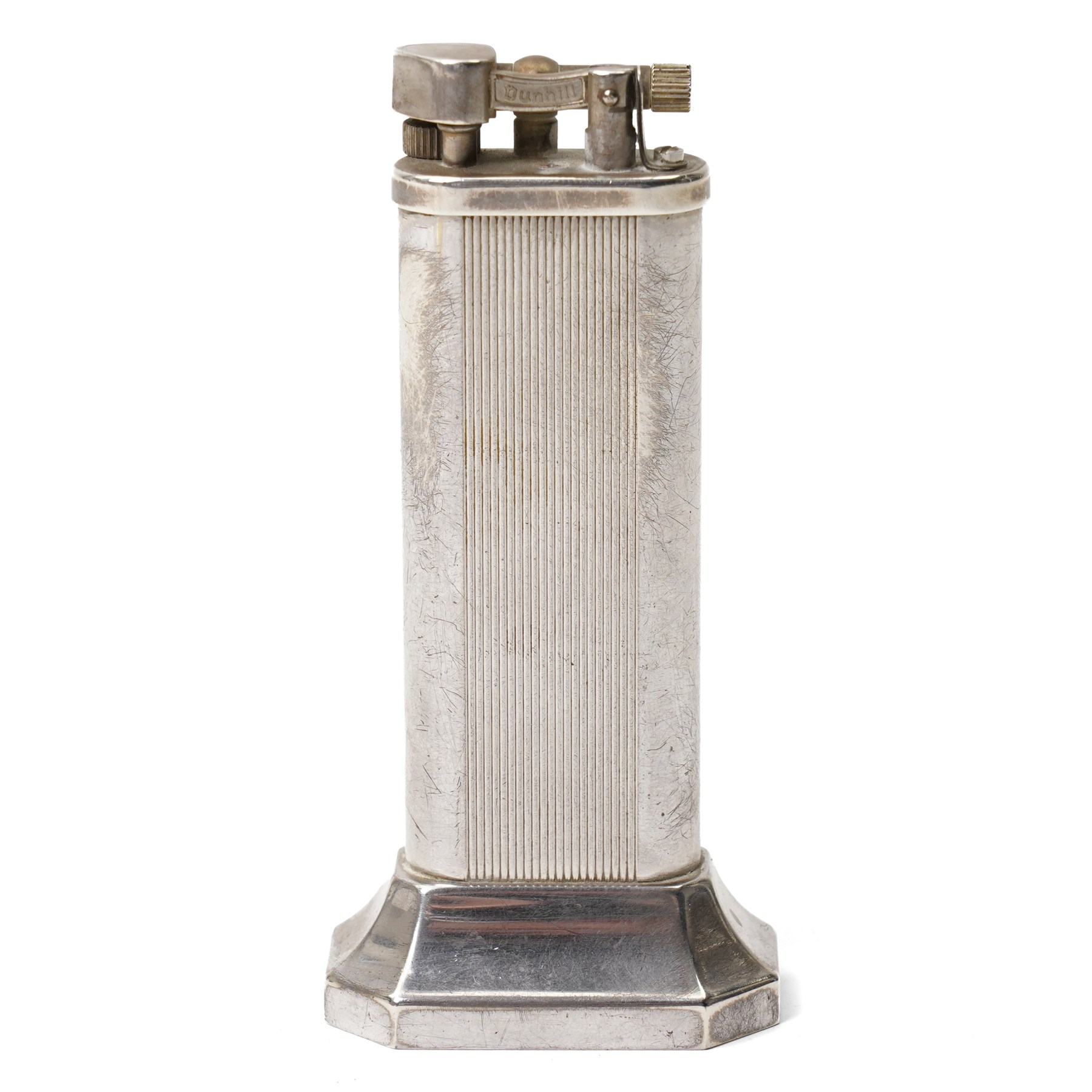 Dunhill - tallboy table lighter, silver-plate with reeded decoration and engine-turned body, on octagonal stepped base H10cm 
