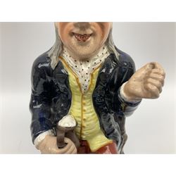 Early 20th century Staffordshire William Kent Squire toby jug, modelled seated upon a corner chair holding a jug of ale in his right hand, H28cm