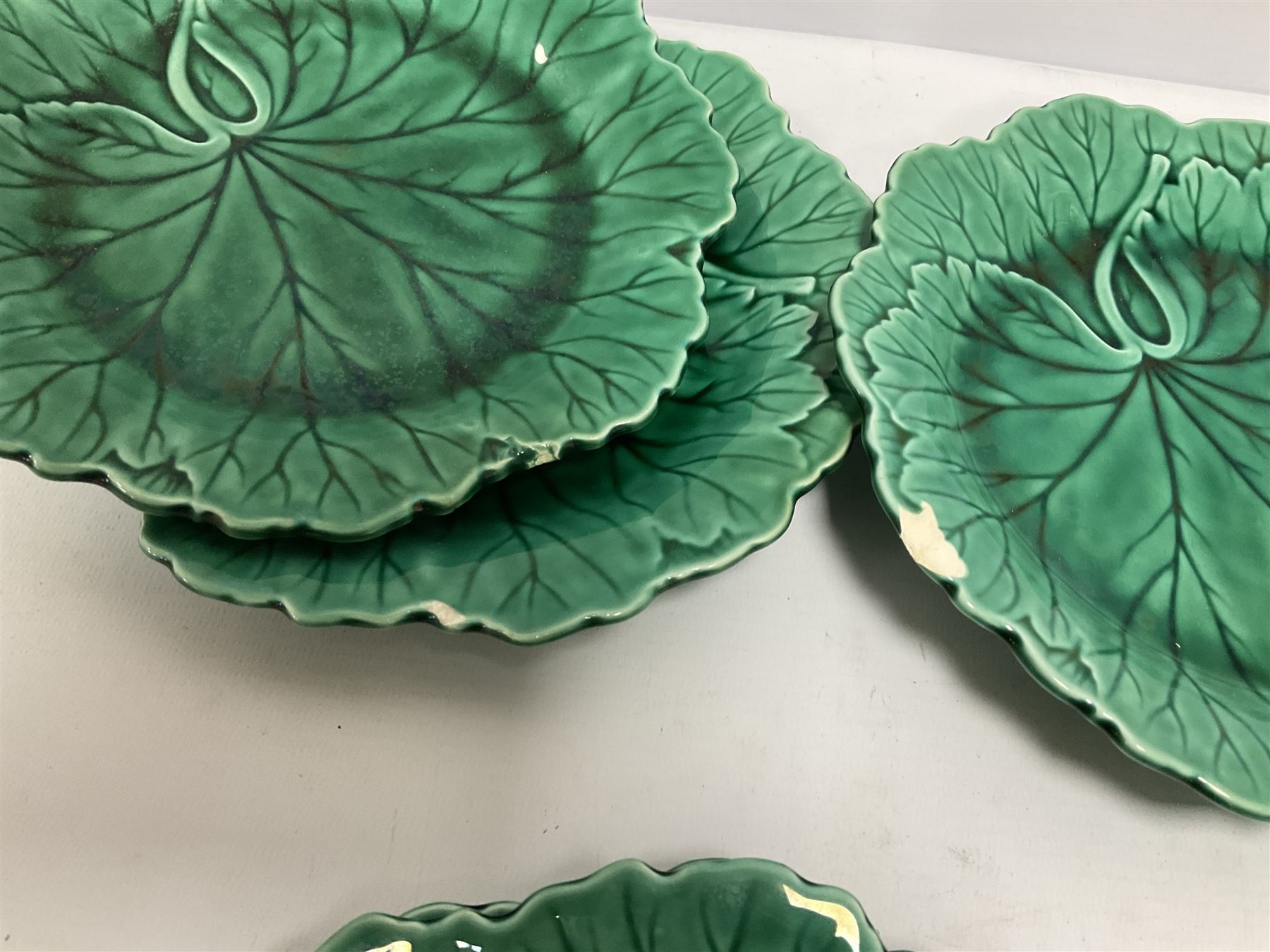Twelve Wedgwood green majolica leaf dishes, all with printed mark beneath, D20cm