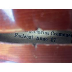 Late 19th century French three-quarter size 'Conservatory' violin with 34cm two-piece maple back and ribs and spruce top, the peg box inscribed 'Conservatory Violin Straduari', bears label 'Antonius Stradiuarius Cremonensis Faciebat Anno 1721' L55.5cm overall; in ebonised wooden 'coffin' case; and Saxony violin c1900 with 36cm two-piece maple back and ribs and spruce top; bears label 'Antonius Stradivarius Cremonensis Faciebat Anno 17**' L59cm overall; in carrying case (2)