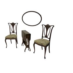 Edwardian drop leaf Sutherland table, a pair of Victorian salon chairs and an oval mirror