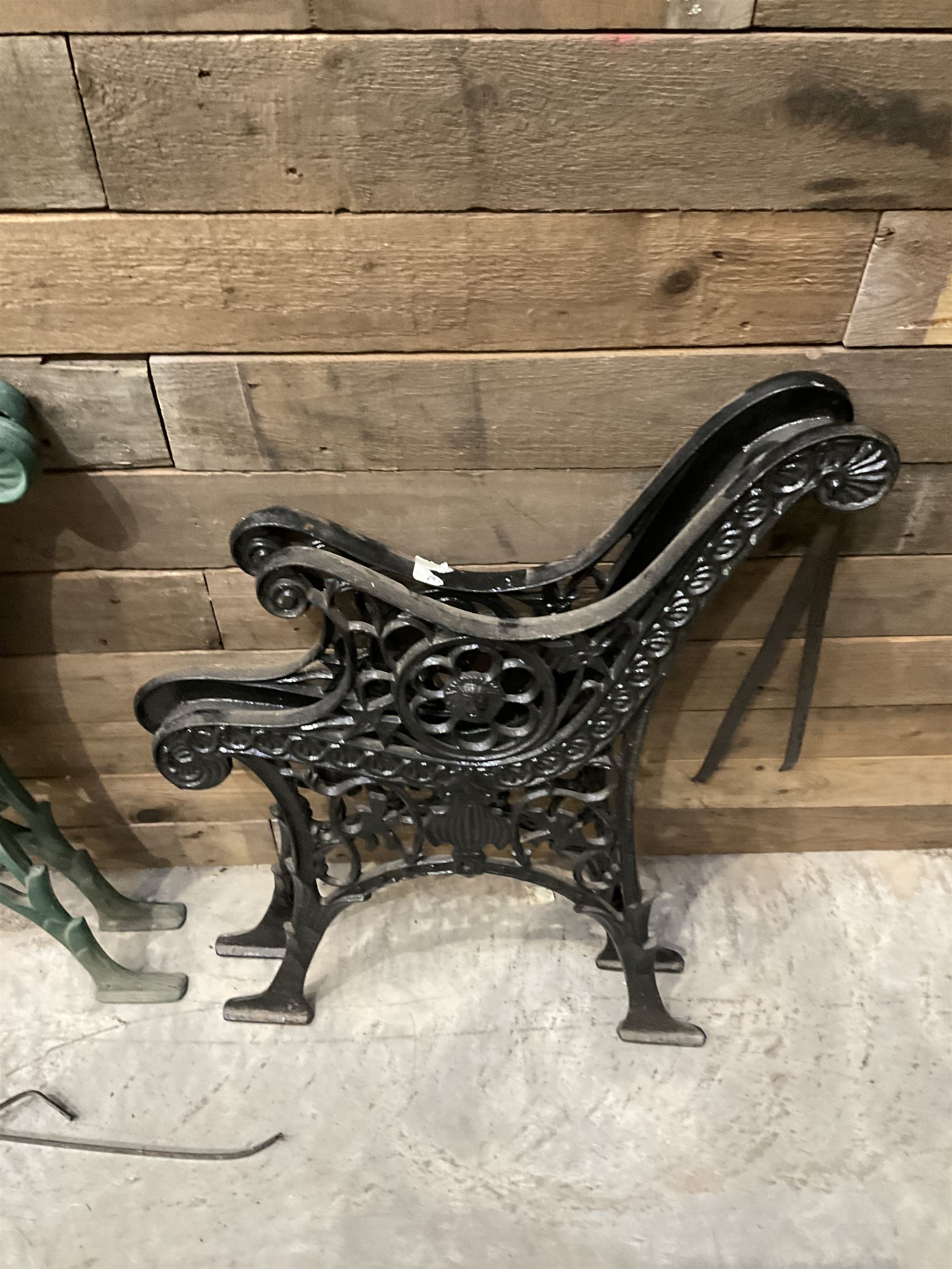 Four pairs of ornate cast iron bench ends (8)