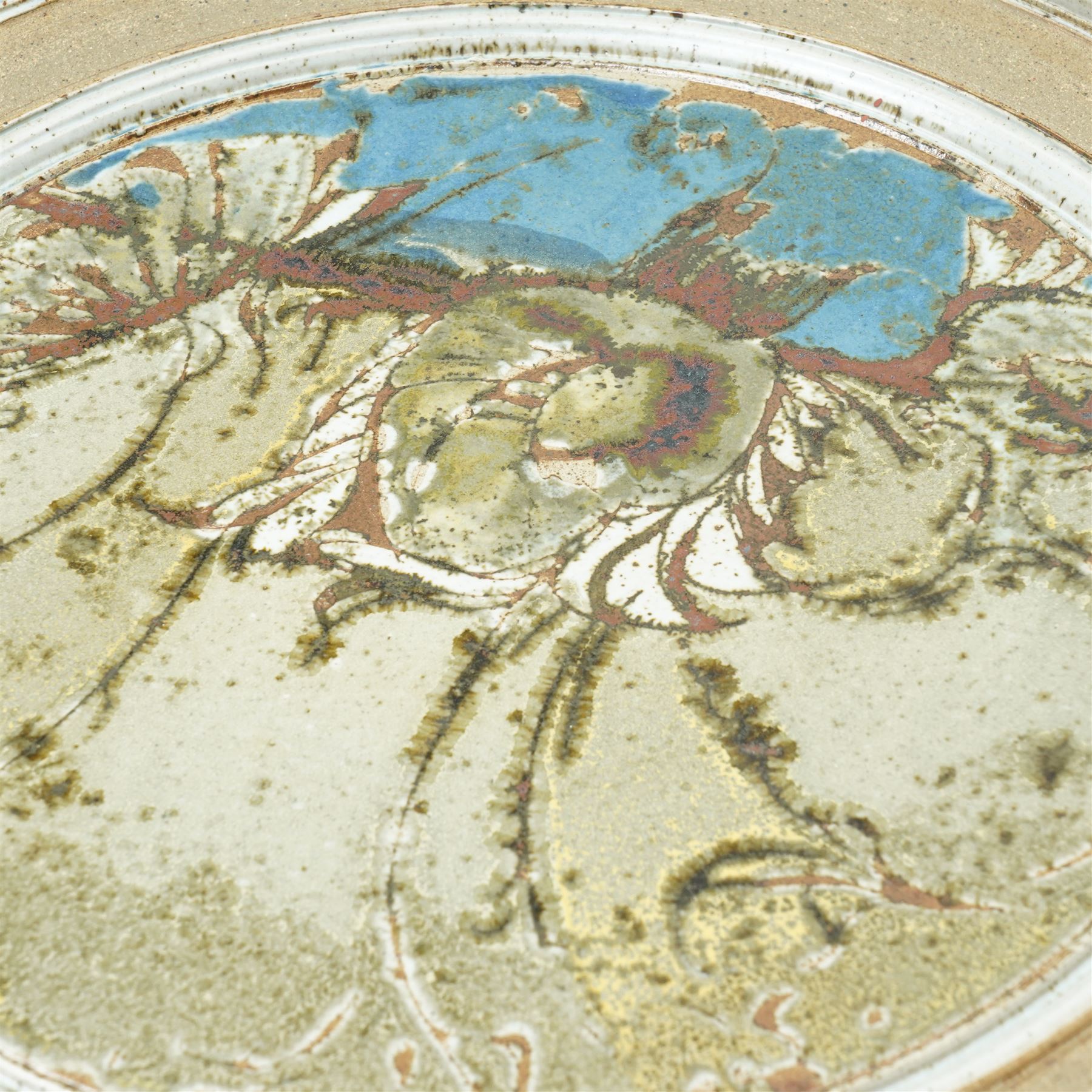 Mick Arnup (British 1925-2008): stoneware wall charger, decorated in mottled glaze with abstract decoration, incised signature to base, D45cm