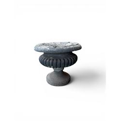 Carved sandstone garden urn, gadrooned campana form