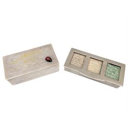 Two three division stamp boxes, the first with enamelled ladybird decoration and engraved initials to the inside of the hinged cover, the second with glass cover showing three King George V stamps