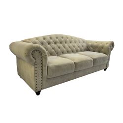 Chesterfield style three seat club sofa, upholstered and buttoned in cream fabric with stud work