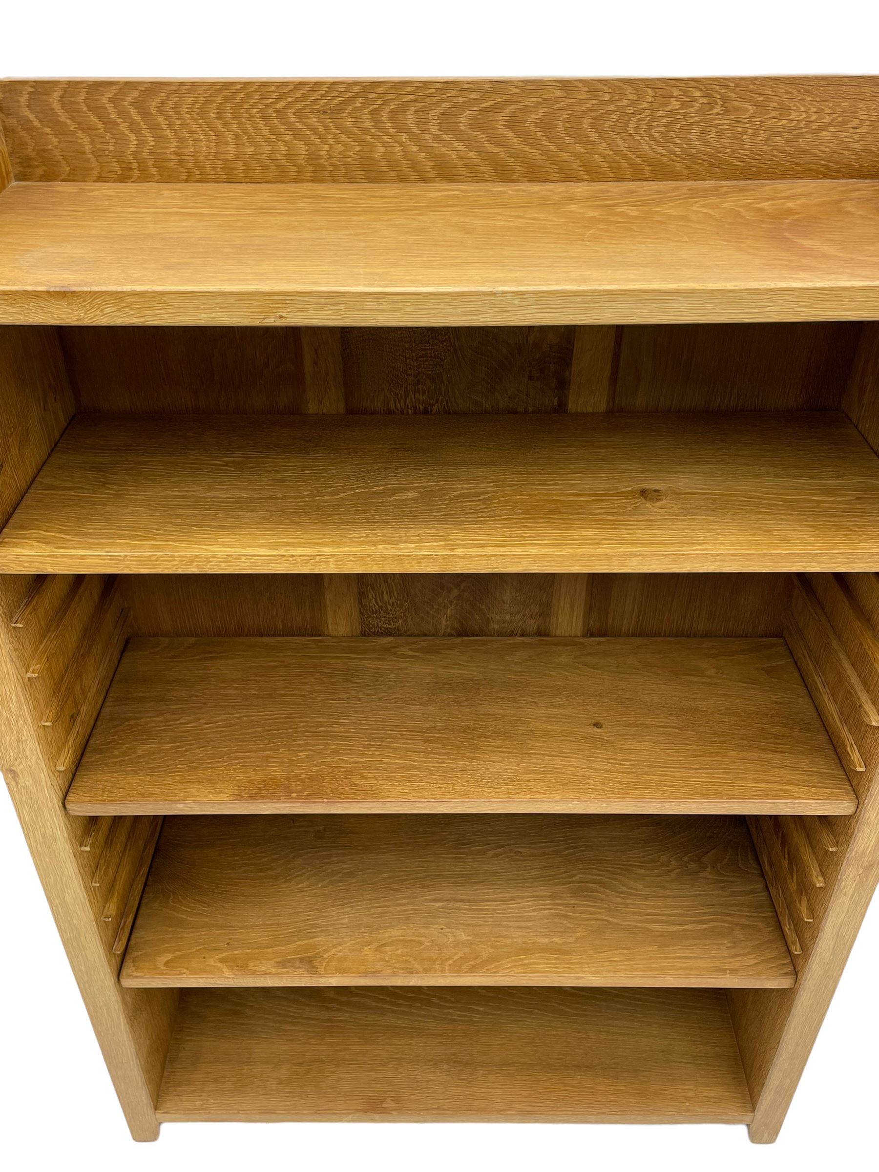 'Rabbitman' oak bookcase, fitted with three adjustable shelves, the top carved with rabbit signature, by Peter Heap of Wetwang