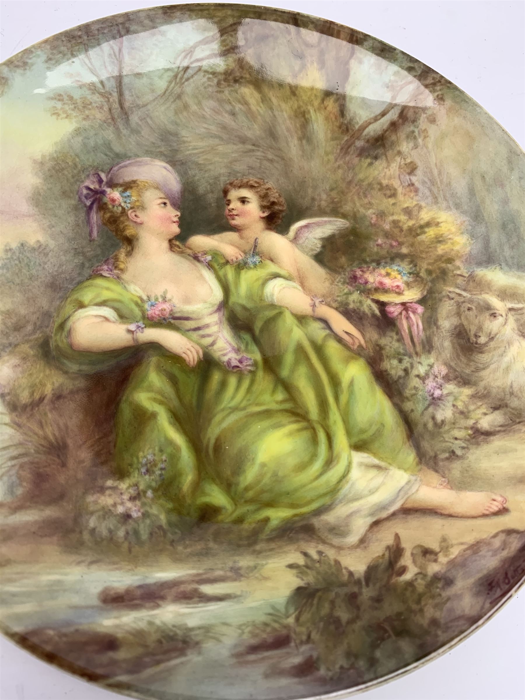 Late 19th century porcelain plate, hand painted by Frederick Sutton, depicting a female figure and putto within a wooded landscape, with recumbent sheep and brook to the fore, signed F N Sutton, unmarked verso, D22.5cm

Frederick Sutton was employed as a painter at the notable factories of Royal Worcester, Coalport, and Minton. 