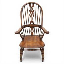 Late 20th century elm and beech high back Windsor armchair, the arched hoop back with pierced vase shaped splat between turned spindles, shaped arm rail on turned supports, saddle seat, raised on turned legs united by a crinoline stretcher