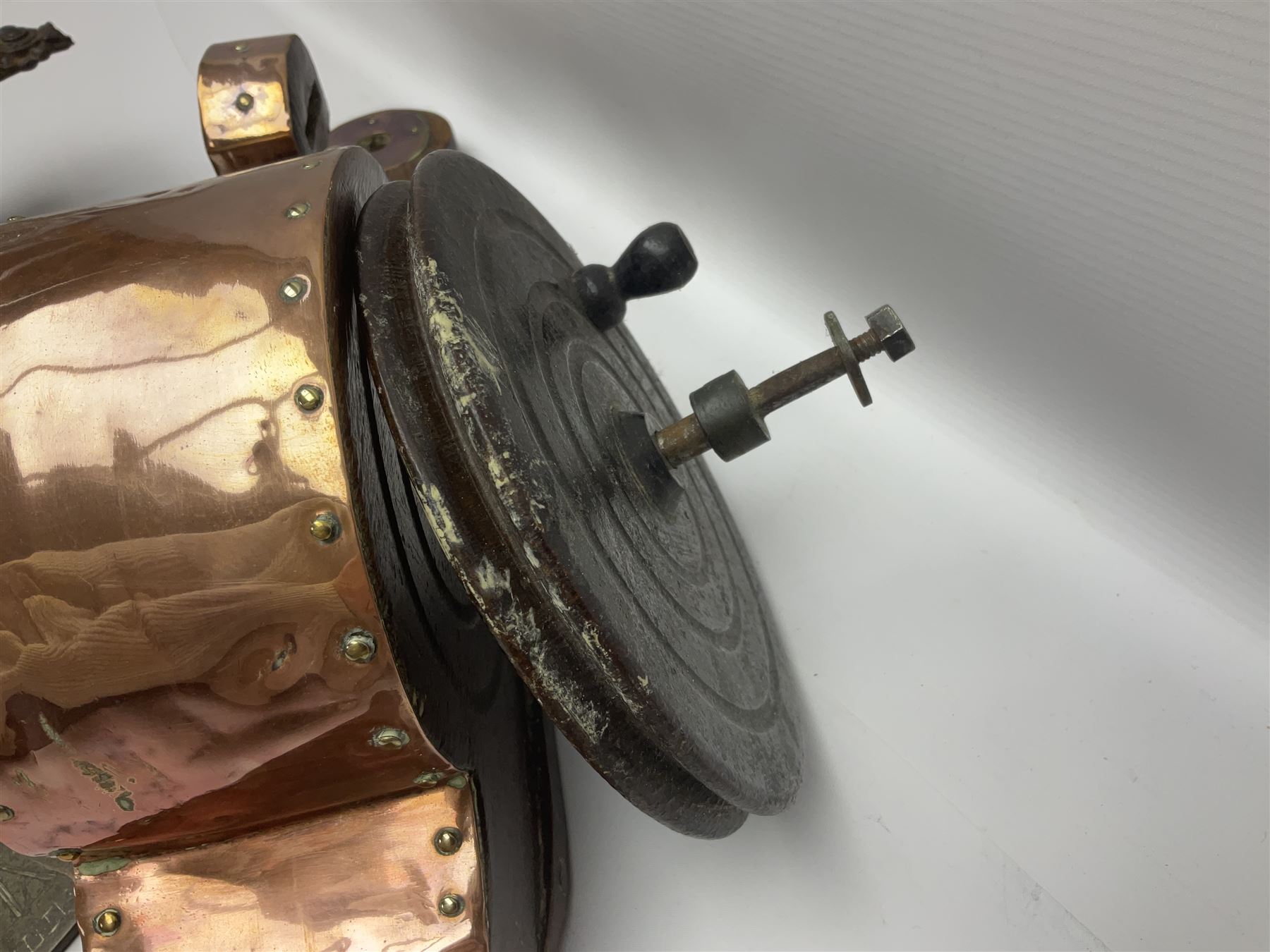 Two 19th century copper tankards, one with weighted wooden base, together with copper and wooden mechanical bellows, sundial and other metalware 