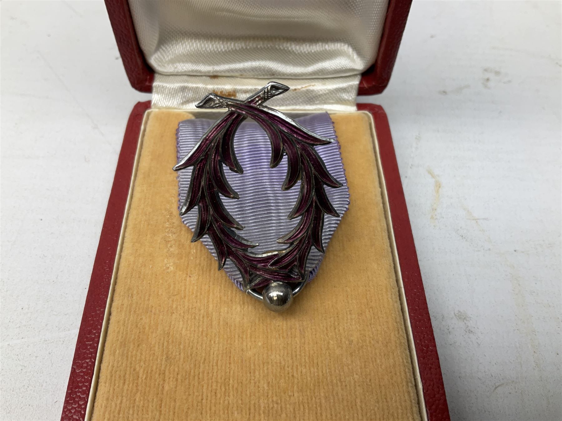 Five continental medals - WW1 Belgian Cross of Fire; WW1 French Croix De Guerre; French Croix De Combattant; French Republic Workers silver merit awarded to L. Mounet 1950; and boxed French Palmes Universitaires Officier d'Academie silver and enamel wreath (5)