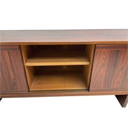 NH Chapman & Co Siesta - mid-20th century sideboard, fitted with three sliding doors, enclosing two drawers and shelves, raised on twin end supports
