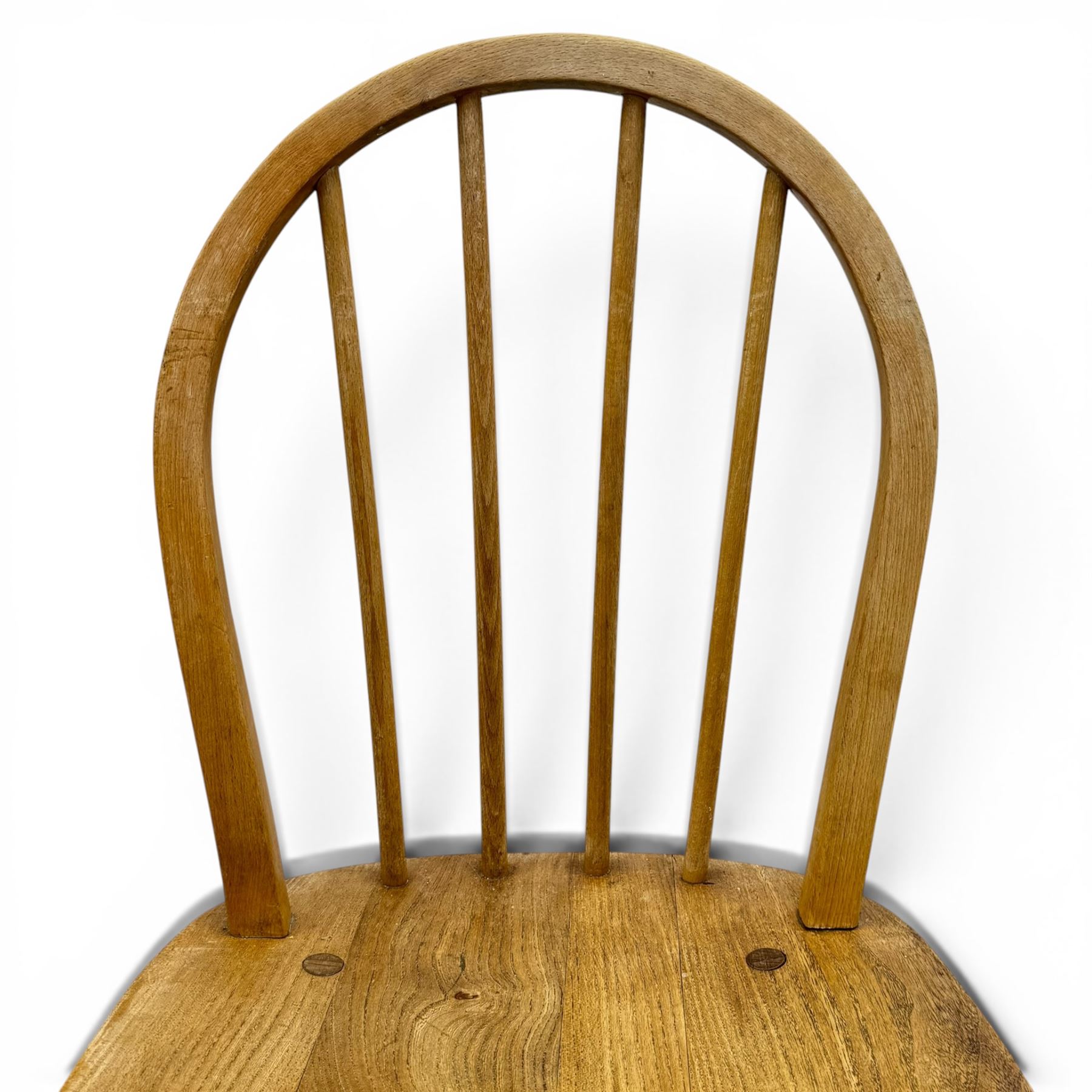 Ercol - set of four elm 'Windsor' chairs, hoop design back dish seat, tapering supports united by H-stretcher 