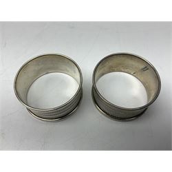Early 20th century silver pepper and a pair of 1930s silver napkin rings, all hallmarked 