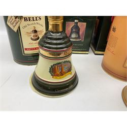 Six Bell's Old Scotch Whisky ceramic decanters comprising Old Scotch Whisky decanter, Christmas decanters 1990, 1991, 1993, 1994 and 1995, all in original boxes and decanter seals intact 