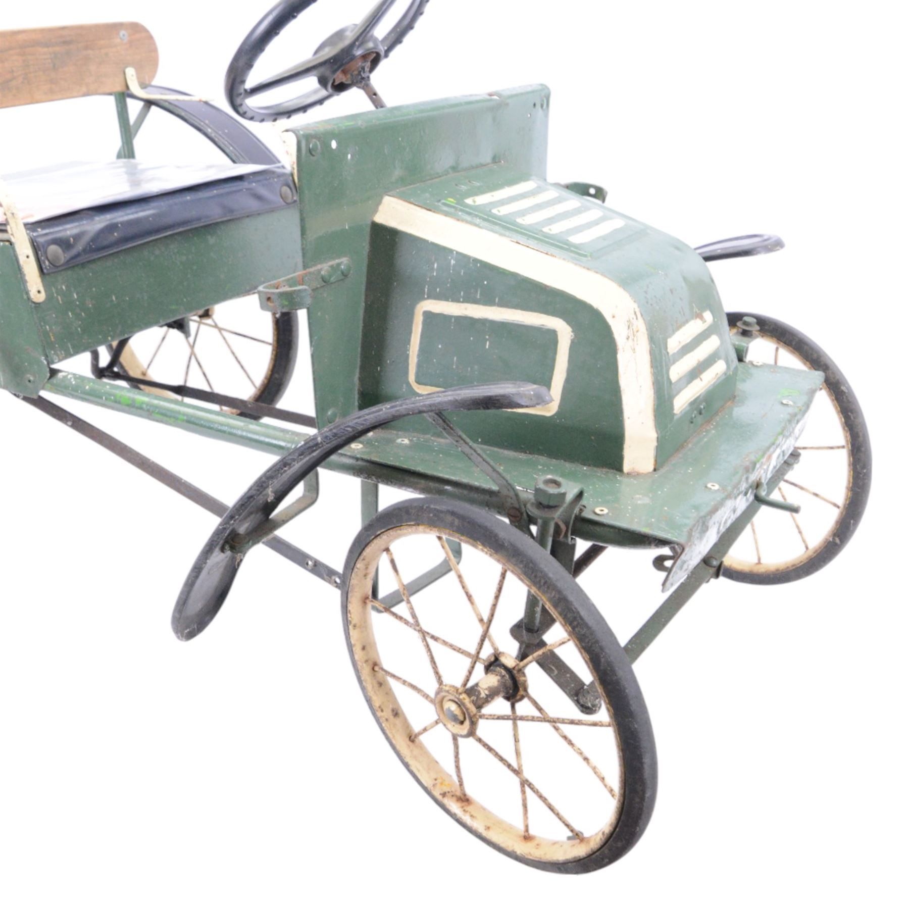 Triang child's pedal car in the style of a vintage automotive, likely a De Dion Bouton or an early Renault, painted in dark green with pale yellow details, H52cm