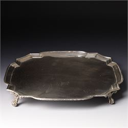 Square silver salver with canted corners and raised border on claw and ball feet 25cm Lond...