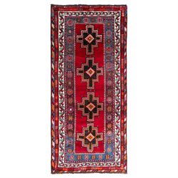 South-west Persian Lori rug, the red field centred by four linked stepped cruciform medall...