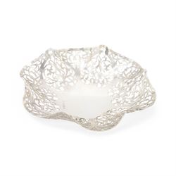 Mid 20th century silver bowl, of hexagonal form with scrolling pierced sides, upon three bun feet, hallmarked W I Broadway & Co, Birmingham 1962, W18cm