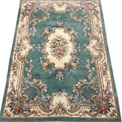 Chinese washed woollen turquoise ground rug, 277cm x 183cm