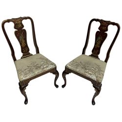 Pair of 20th century Chinoiserie hardwood lacquered hall chairs, the shaped splat and apron painted with gilt traditional scenes and birds, seat upholstered in floral and bird patterned fabric, raised on cabriole supports with inner c-scrolls