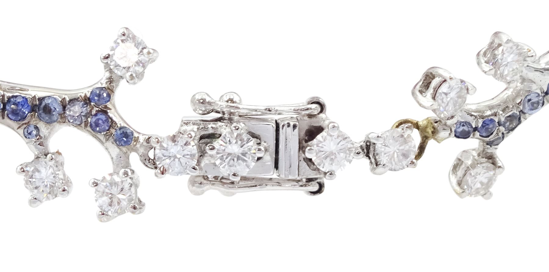 18ct white gold gemstone set floral jewellery suite, comprising necklace, pair of earrings and bracelet, each with tourmaline flower petals, round brilliant cut diamond centres and sapphire stems, stamped