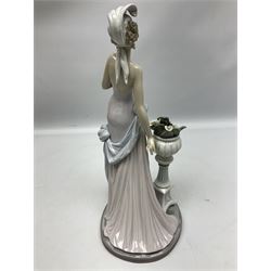 Four Lladro figures, comprising Touch of Class no 5377, Boy Student no 4517, Ocean Beauty no 5785 and Carnival Couple no 4882, largest example H45cm