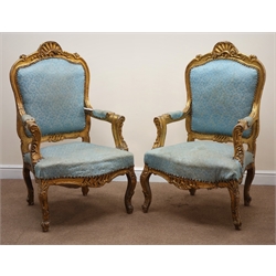  Pair French style gilt framed armchairs, shell carved cresting rail, upholstered back, seat and arms, serpentine front, cabriole legs, W74cm  