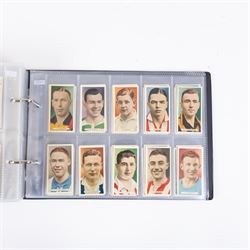 Collection of Edwardian and later Football related trading and cigarette cards, including forty-nine of fifty 1906 Ogden's Football Club Colours, 1922 PALS Footall series, ninety of one hundred 1925 Gallaher Famous Footballers, complete set of forty-four 1926 Ogden's Captains of Association Football Clubs and Colours, complete set of fifty 1927 Players Football Caricatures by MAC,  complete set of fifty 1927 Players Football Caricatures by RIP,  complete set of fifty 1930 Players Association Cup Winners, complete set of 50 1933 Ogdens AFC Nicknames etc, housed in brown cigarette card album