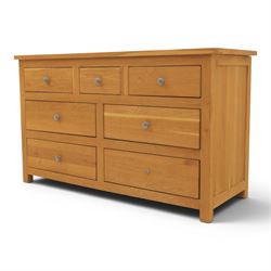 Solid oak chest of drawers, three over four drawers with metal pulls 