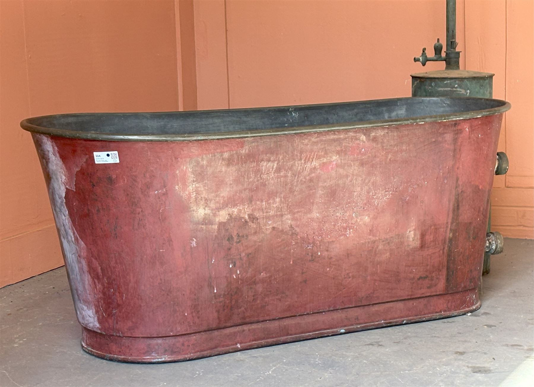 French copper bath  (L144cm W64cm H62cm) together with a primitive plunger shower. (H227cm) - COLLECTION BY APPOINTMENT FROM: The White House, Thirsk Road, Easingwold, York, YO61 3NF - CALL 01723 507111 TO ARRANGE