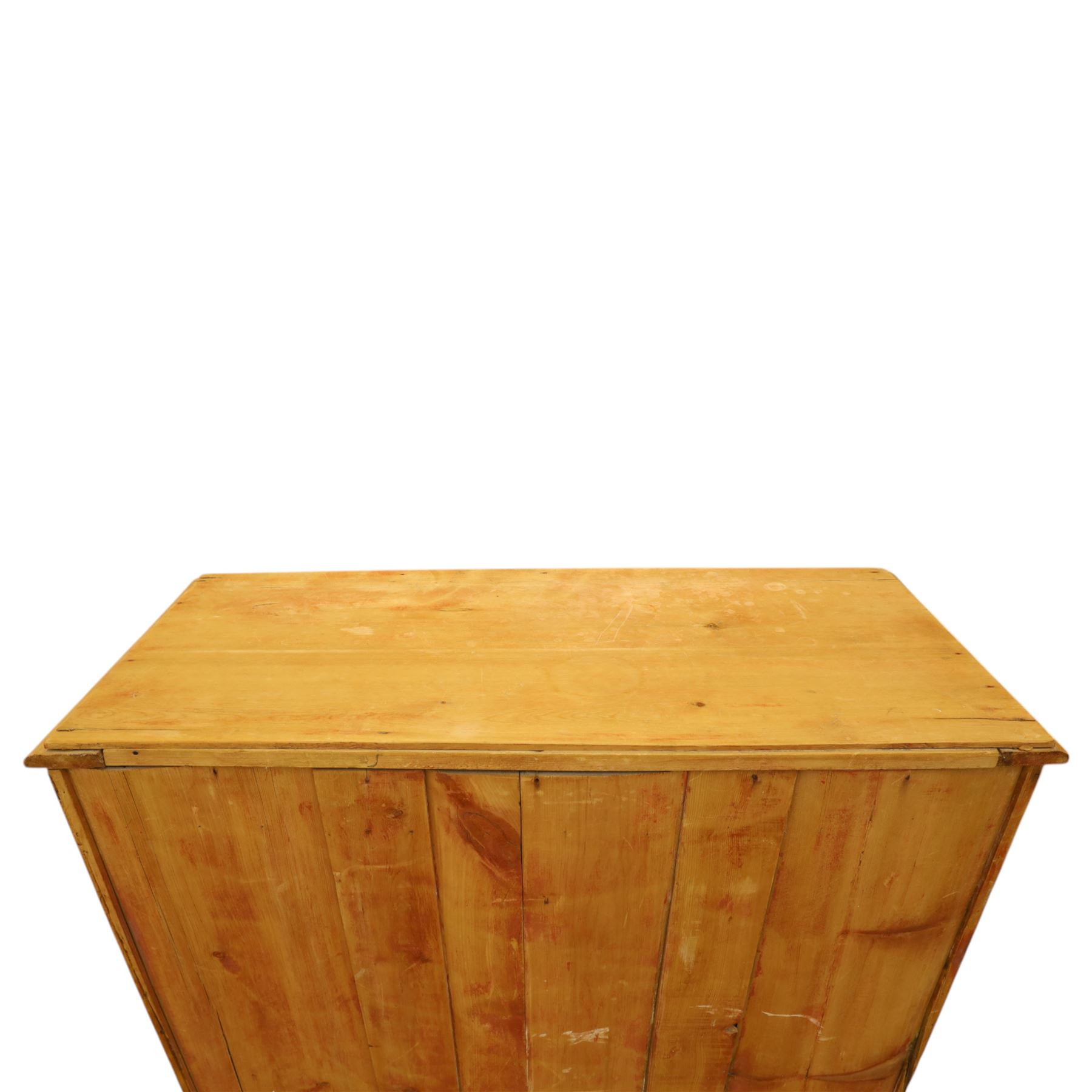 Victorian stripped pine chest, fitted with two short and three long drawers, turned wooden handles, shaped lower apron on bracket feet