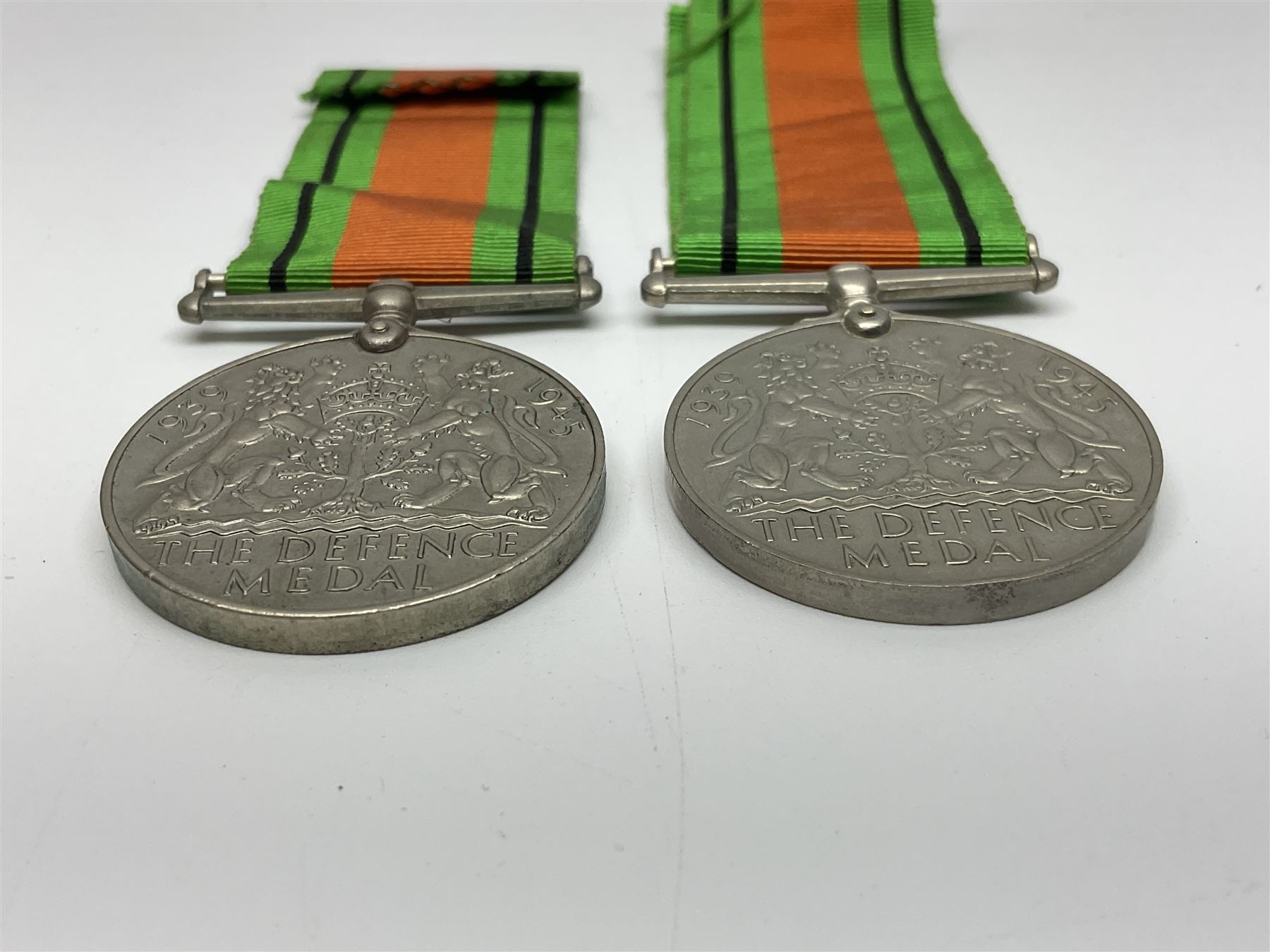 Eleven WW2 medals comprising three 1939-1945 war medals, two Defence medals, three 1939-1945 Stars, Atlantic Star, Africa Star and Italy Star; miniature QEII Naval LS & GC medal; all with ribbons; and WW2 postumous medal slip to Flight Sergeant L.N. Clark