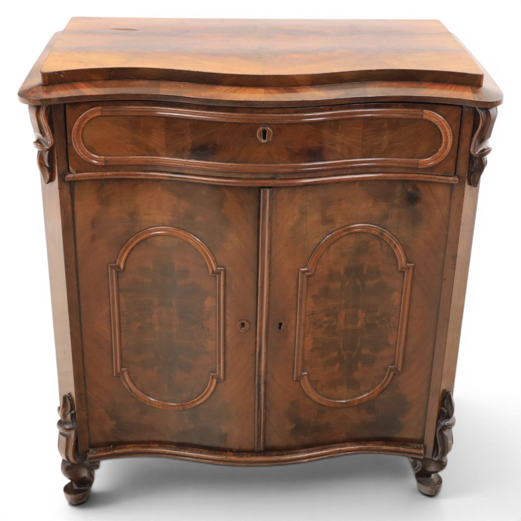 Victorian mahogany chiffonier, with serpentine front and book-matched veneered top, over a frieze drawer and cabinet, raised on pad feet