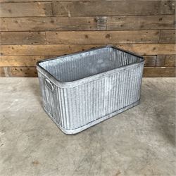 Set of three pressed metal planters in different sizes