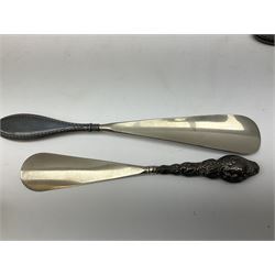 Set of six silver handled butter knives, in case, pair of silver handled fish servers, two silver handled shoe horns, and two silver handled button hooks, all hallmarked or stamped Sterling