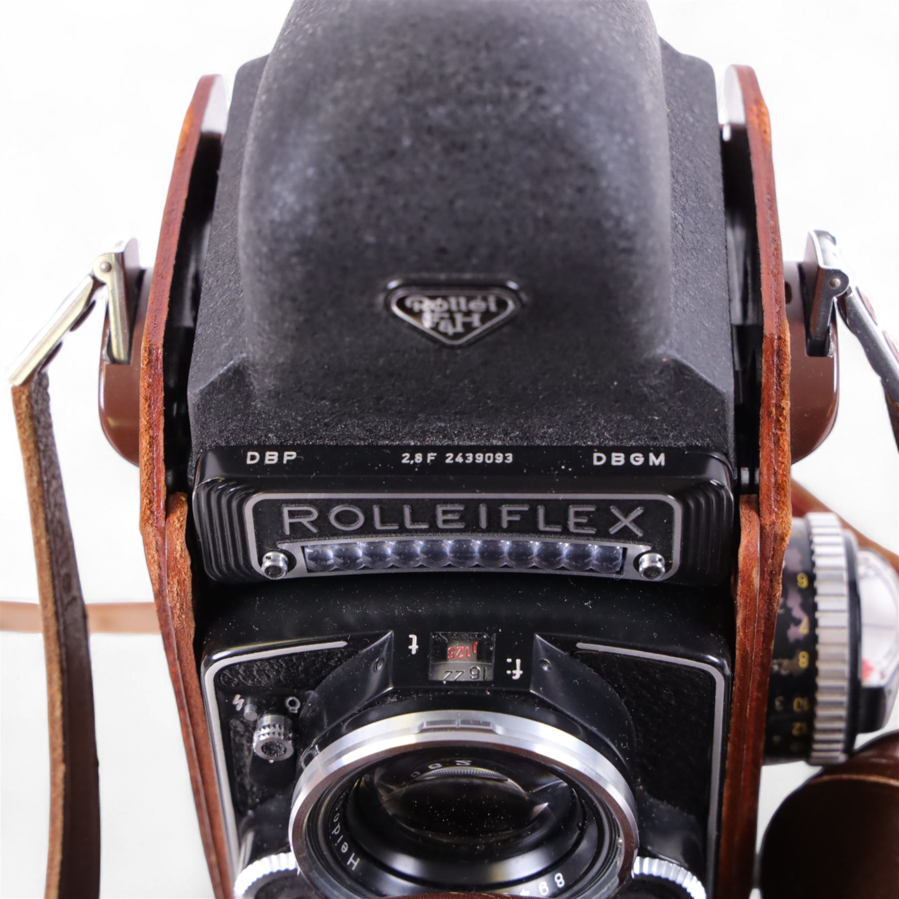 Rolleiflex Franke & Heidecke DBP DBGM 2.8 F TLR camera serial no. 2439093, with a Heidosmat 1:2.8/80 lens serial no. 894062 and a Carl Zeiss Planer 1:2.8 f=80mm lens serial no. 4092068, in leather case with instruction booklet