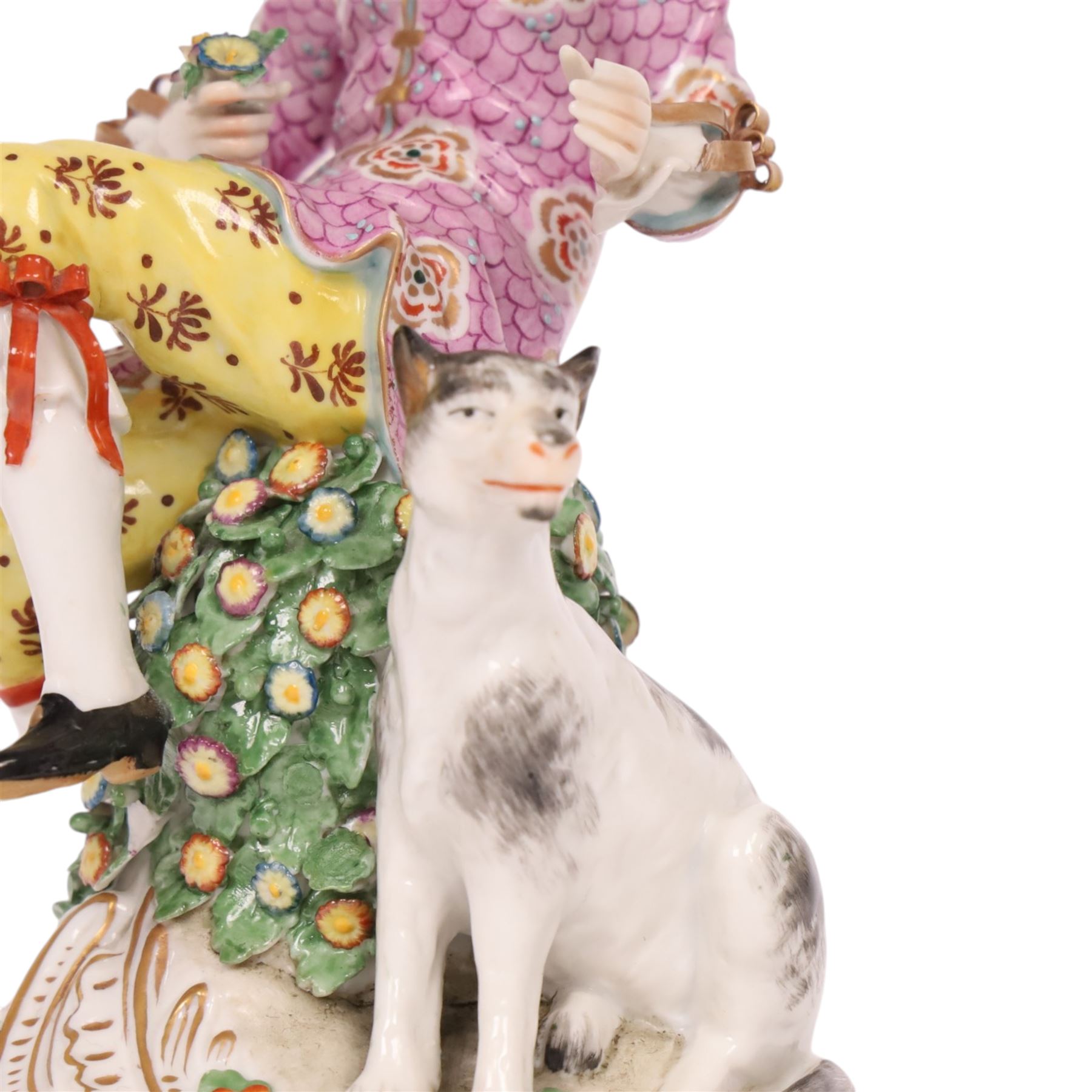 Pair of 19th century Samson figures, the gentleman wearing a wide brimmed hat with a dog, the lady with a sheep by her side, both figures seated upon a floral encrusted pillars with gilt scrolling base, H22cm
