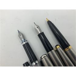 Group of Parker fountain and ballpoint pens, comprising a black Chinese style pen with engraved barrel and gold nib stamped 18K-750, gold plated example with engine turned decoration and gold nib stamped 14K, and five further to include stainless steel examples, together with two Cross USA pens and Parker pen box (9)