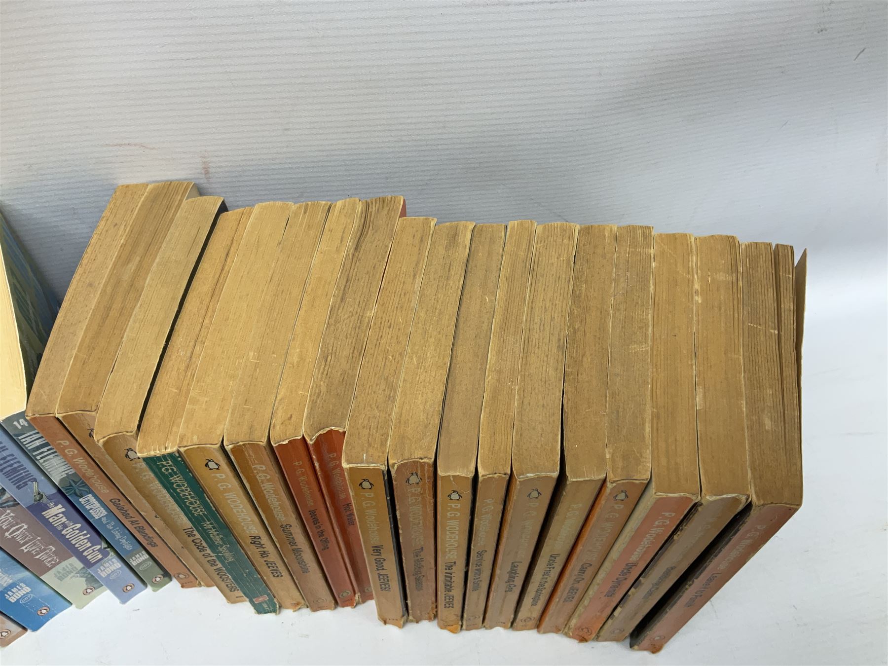 Wodehouse P.G.: Mr. Mulliner Speaking. First American edition 1930; eighteen P.G. Wodehouse paperback books; fourteen James Bond paperback books and Corgi tin of four James Bond die-cast model cars