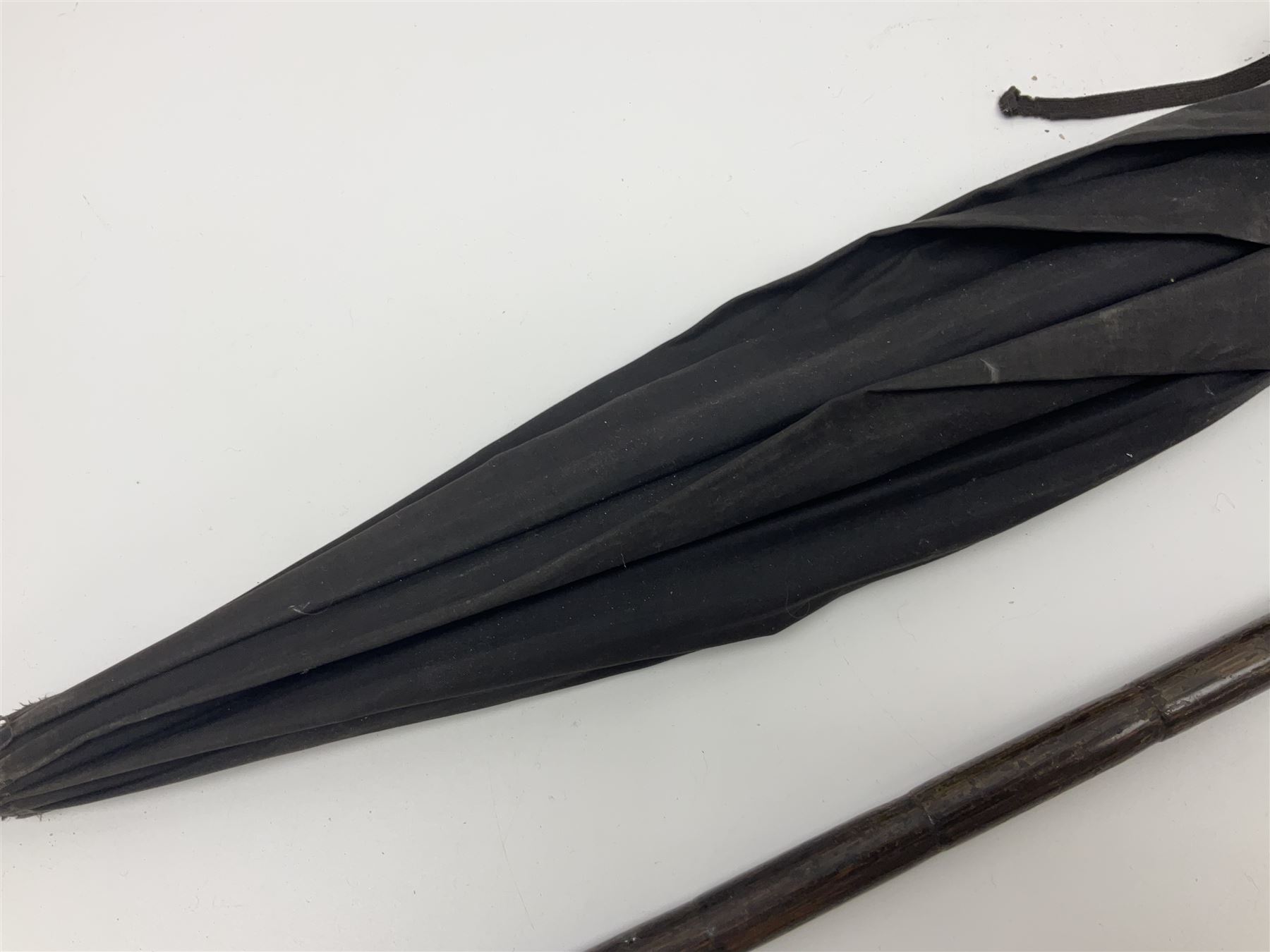 Early 20th century curved horn handle walking stick with hallmarked silver mounts, engraved L Russell 1918, together with a shooting stick by William Mills Birmingham, with leather handle, 'The Featherwaite' shooting stick and an umbrella with wooden handle