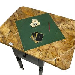 Victorian ebonised drop-leaf pot cupboard with later trompe l'oeil painted top, depicting marbled surface with baize cloth, playing cards and pencil, fitted with two drawers to one end and cupboard to the other with marble inset, on turned and faceted supports with brass castors