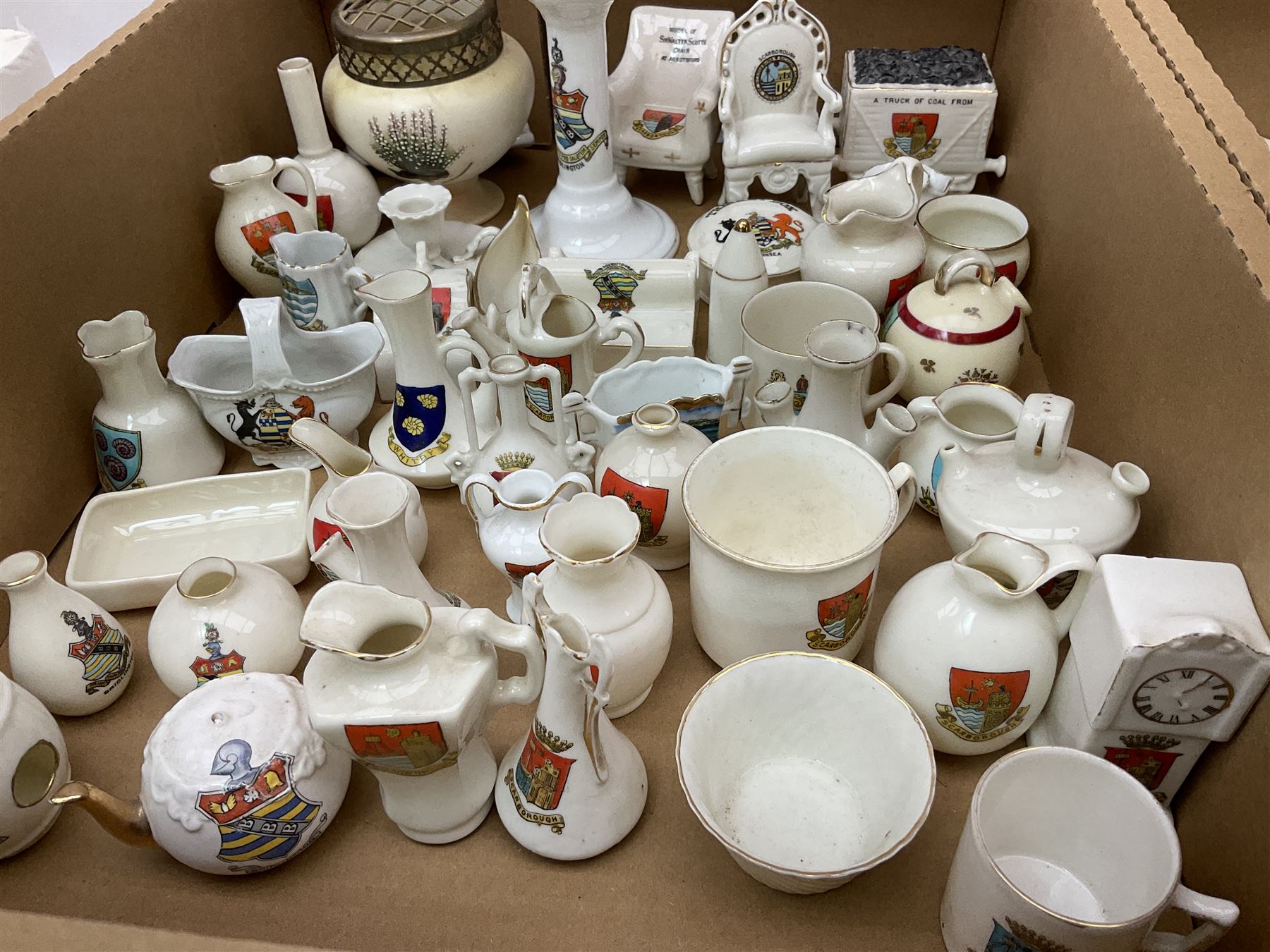 Collection of crested ware, to include Scarborough Willow Art coal truck, Whitby Willow Art Burns and Highland Mary figure group, Carlton China beer drinker 'Tak Hod an Sup Lad', and 'Here's ta me an'ma wife's usban', lighthouse, boat, Kingsway Art China Sir Walter Scott's Chair, butter dishes, candlestick, pianos etc