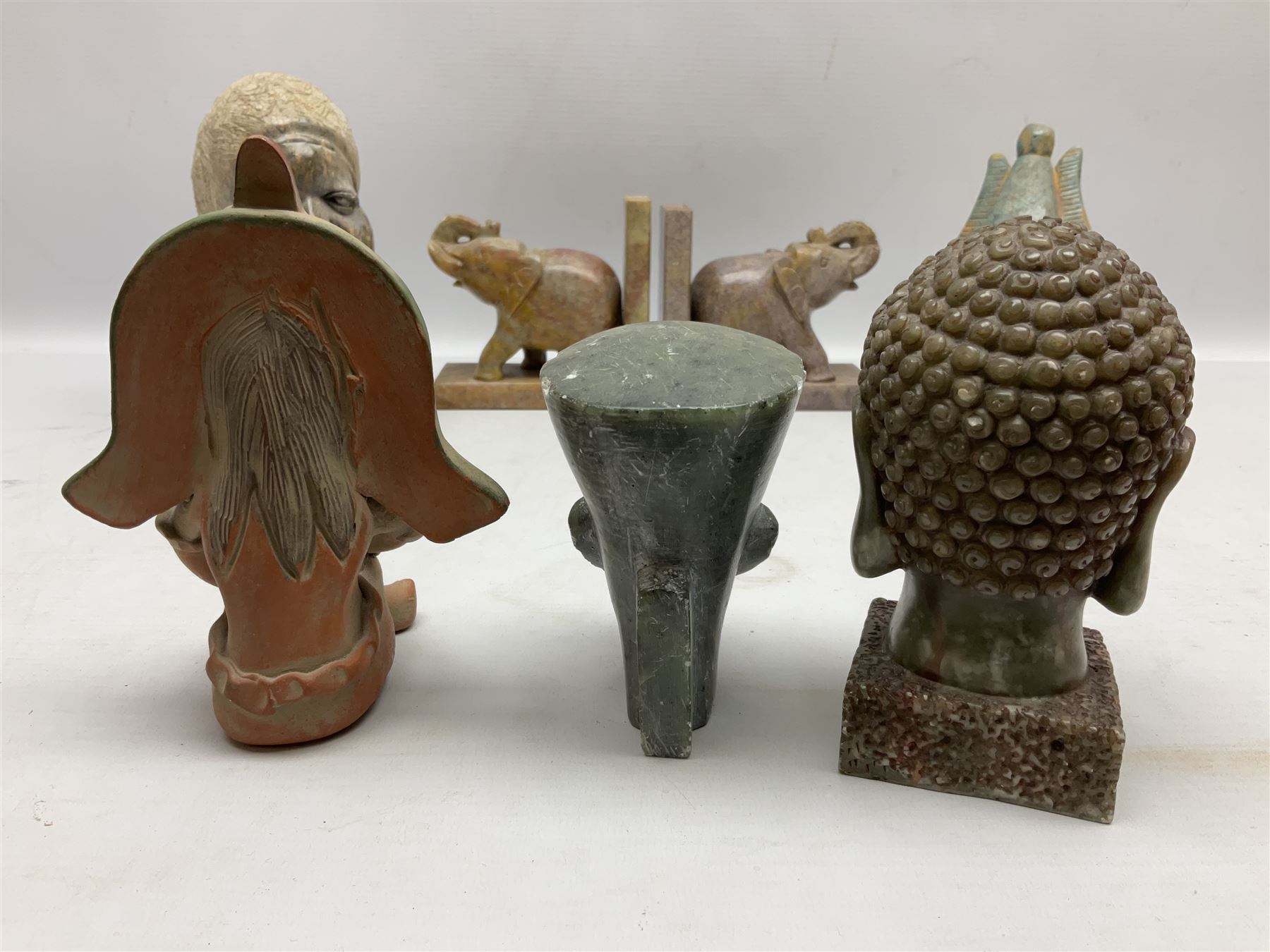 Pair of soapstone figural bookends carved with elephants, African soapstone bust, Buddha bust, Egyptian style etc, tallest H18cm