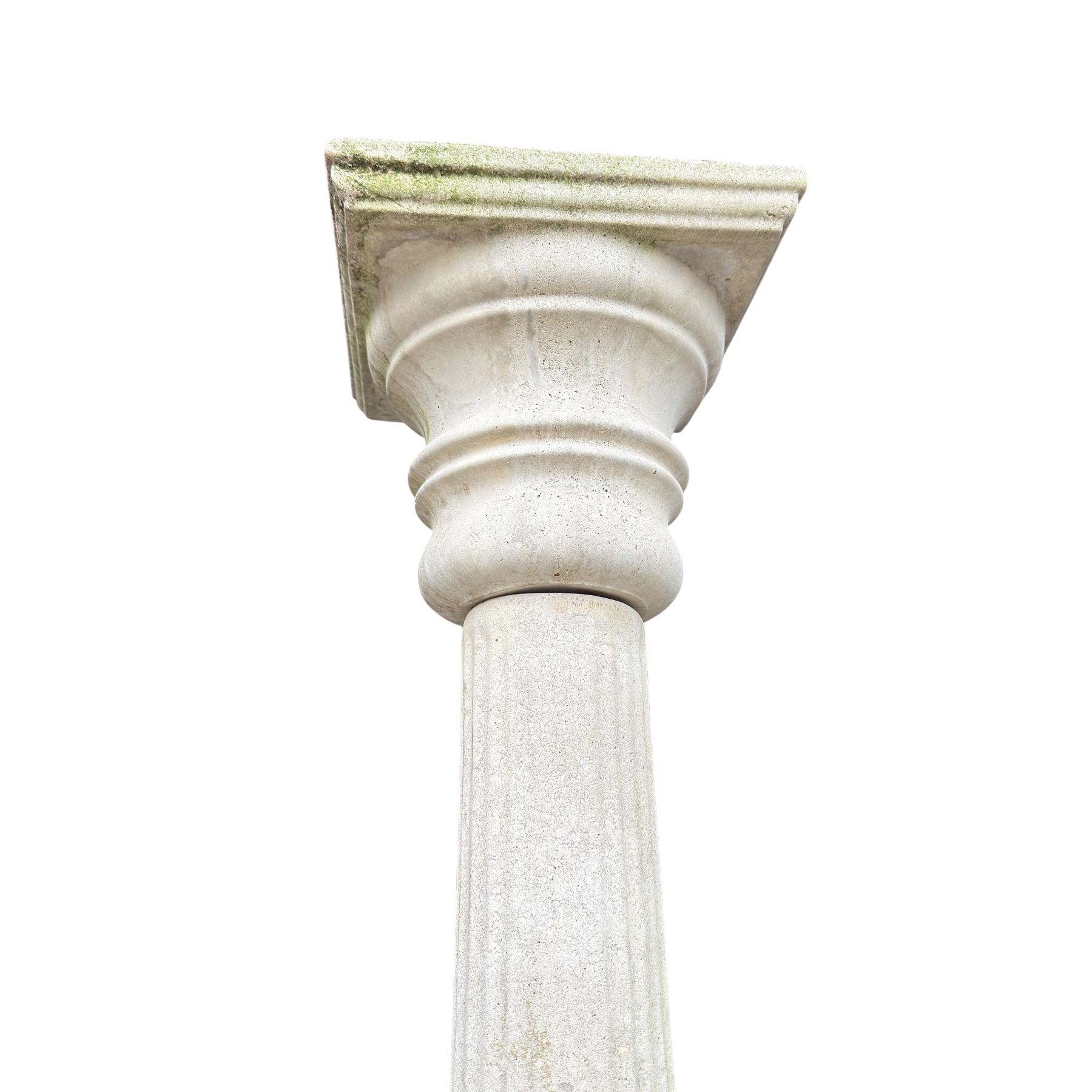 Weathered cast stone sundial on fluted pedestal