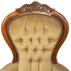 Pair of Victorian design stained beech armchairs, scroll and scallop carved cresting rail, upholstered in buttoned champagne fabric, on cabriole supports