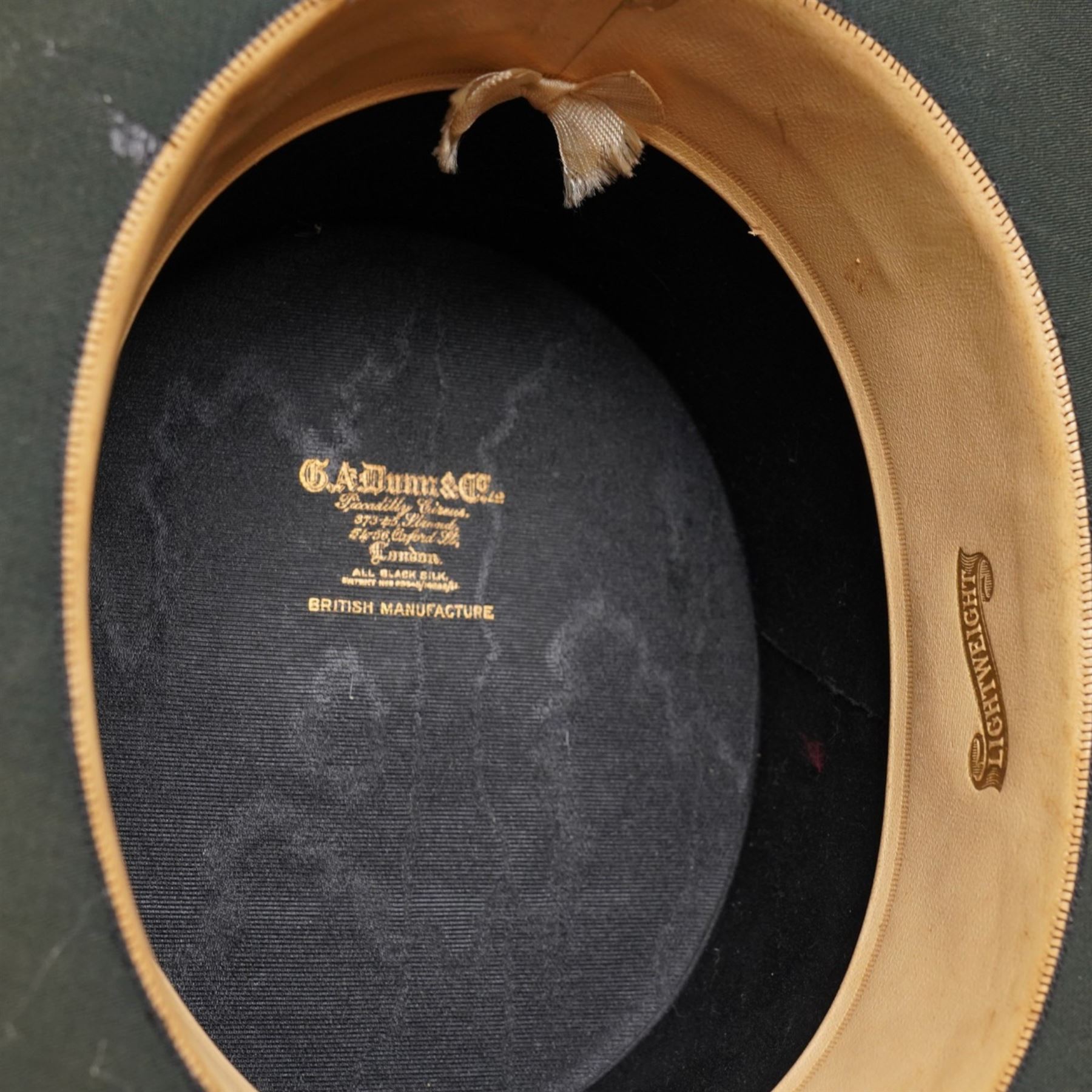 Victorian leather travelling case for hats, with C.A. Dunn top hat, the case with impressed Army & Navy Makers mark, the lid with the initals W.S.H.S, with key, H31cm, W45cm, D50cm