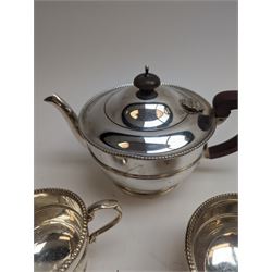 1930s silver three piece tea service, comprising teapot, milk jug and sugar bowl, each of circular form with oblique gadrooned rim, the teapot with Bakelite handle and finial, hallmarked Mappin & Webb Ltd, Birmingham 1931, teapot H14.5cm