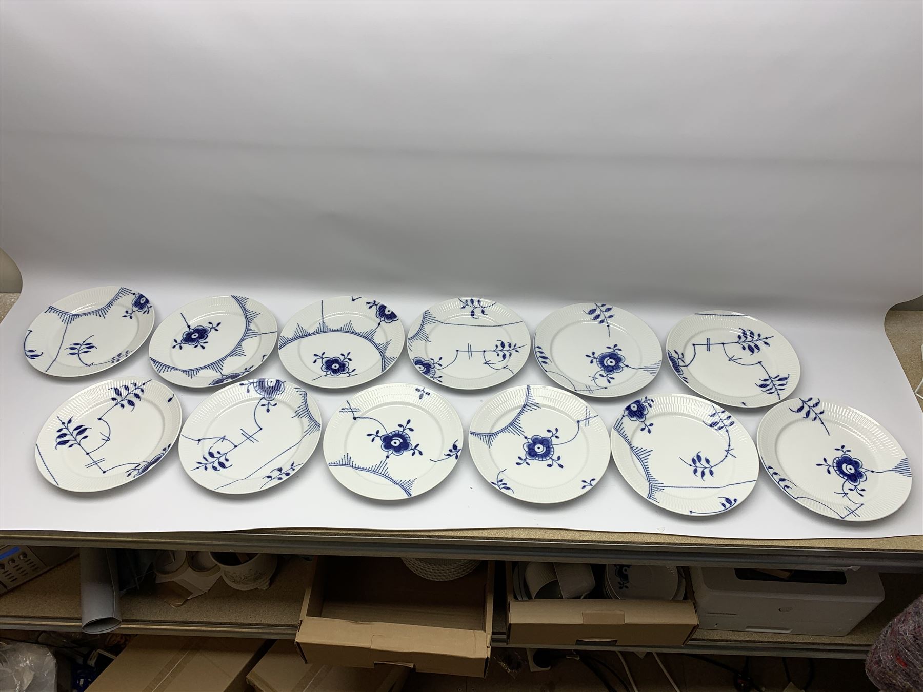 Royal Copenhagen tea and dinner service for twelve place settings, decorated in the Mega Blue Fluted pattern, pattern number 622, comprising dinner plates, salad plates, bowls with pierced rim, smaller bowls, tea cups, and saucers, dinner plates D27.5cm, salad plates D22cm